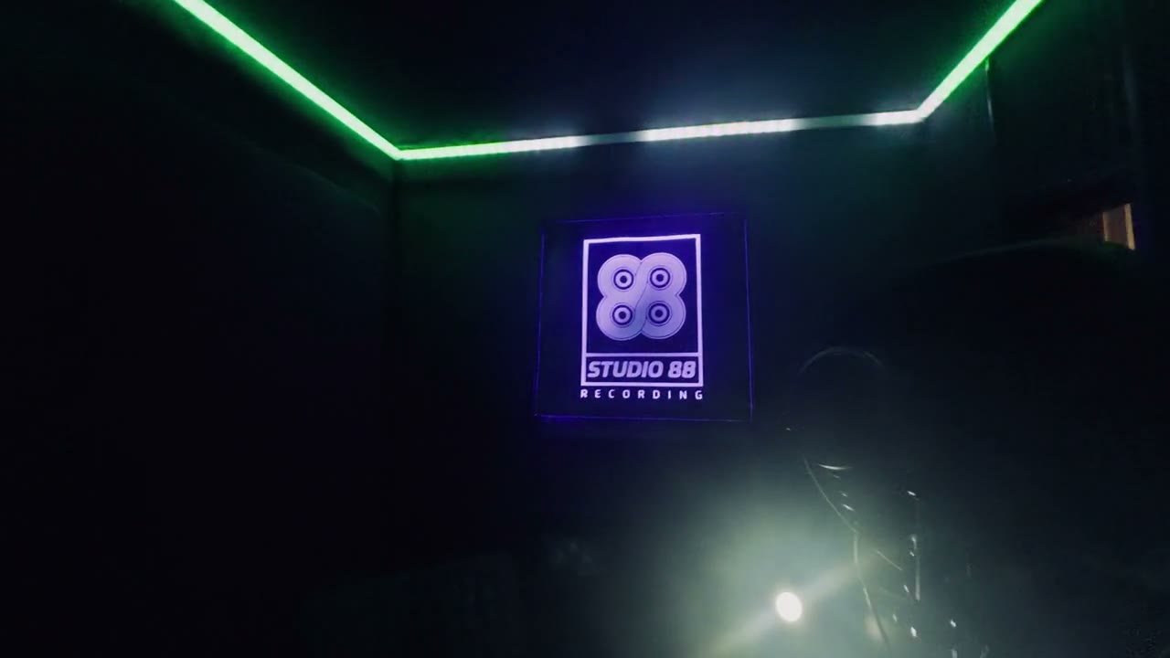 Vocal booth with microphone and green LED strip